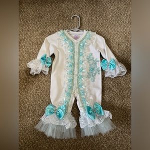 Beautiful onesie for baby girl. Hand made bought from local boutique